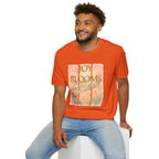 Joy Blooms Here – Christian Floral Encouragement Tee
