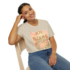Joy Blooms Here – Christian Floral Encouragement Tee