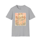 Joy Blooms Here – Christian Floral Encouragement Tee